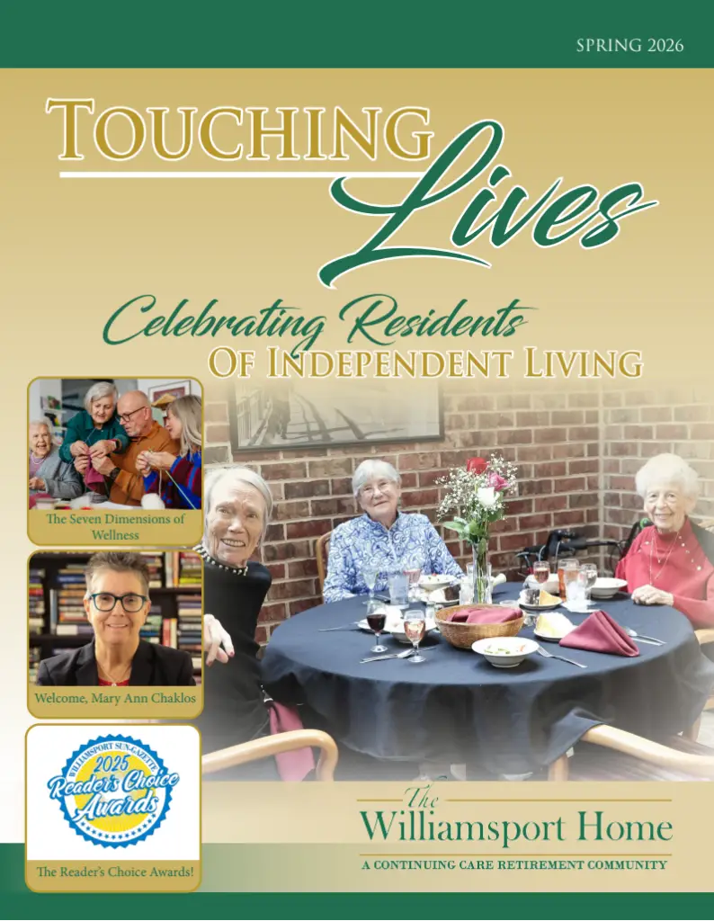 Cover of a retirement community brochure showing seniors at a table, with the title 'Touching Lives' and 'The Williamsport Home' at the bottom edge.